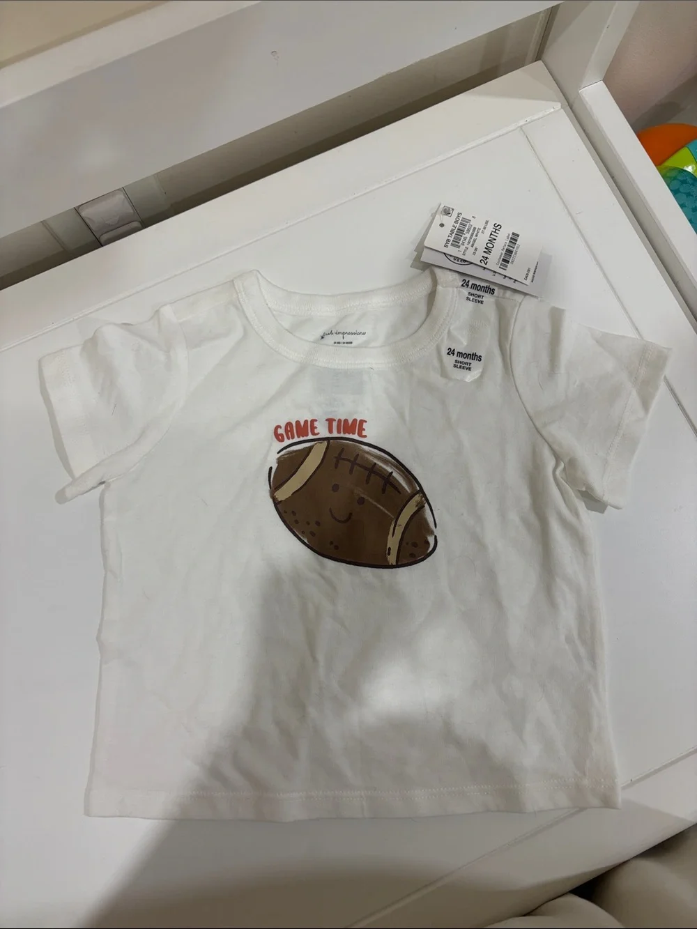 First Impressions White Tee with Brown Football 'Game Time'